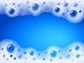 Soap foam overlying on the background of a blue water color Royalty Free Stock Photo