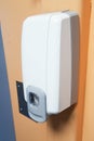 Soap hand sanitizer dispenser hanging on the wall to disinfect hands automatic alcohol