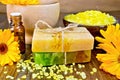 Soap homemade and salt with calendula on board Royalty Free Stock Photo