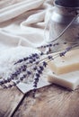 Soap, lavender, salt and old can on wooden board Royalty Free Stock Photo