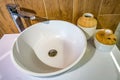 Soap and shampoo dispensers near Ceramic Water tap sink with faucet in expensive loft bathroom Royalty Free Stock Photo