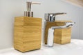 Soap and shampoo dispensers near Ceramic Water tap sink with faucet in expensive loft bathroom Royalty Free Stock Photo