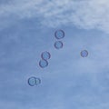 Soapbubbles flying in the sky Royalty Free Stock Photo