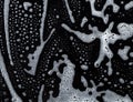 Soapy foam texture on black Royalty Free Stock Photo