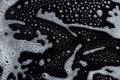 Soapy foam texture on black Royalty Free Stock Photo