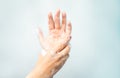 Soapy hands on a blue background Royalty Free Stock Photo