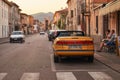 Yellow SAAB 900S cabriolet car parked on the street of Soave, Italy