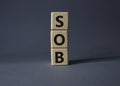 SOB - Shortness of breath symbol. Wooden cubes with words SOB. Beautiful grey background. Medical and SOB concept. Copy space