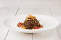 Soba noodles of buckwheat Noodles of buckwheat yellow pepper, tomato and herbs. Pan-Asian cuisine. Place for text Royalty Free Stock Photo