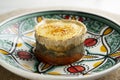 Sobrasada with baked aubergine with caramelized goat cheese. Tapa of the island of Mallorca.