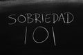 Sobriedad 101 On A Blackboard. Translation: Sobriety 101