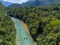 Soca Valley, Slovenia - Aerial view of the emerald alpine river Soca with kayaks and rafting boats going down the river Royalty Free Stock Photo