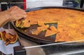 Socca, chickpea pancake cooked at a farmers market in Old Town Nice, France Royalty Free Stock Photo