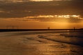 Soccer arcs on the beach at dusk