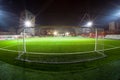 Soccer arena in night illuminated bright spotlights