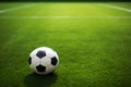 A soccer ball against a picturesque soccer field background