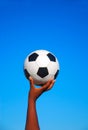 Soccer ball in black hand Royalty Free Stock Photo