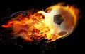 Soccer ball with bright flame flying on background