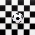 Soccer ball on chequered pattern Royalty Free Stock Photo