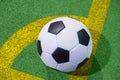 Soccer ball on a corner kick line on an artificial green grass top view Royalty Free Stock Photo