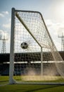 Soccer Ball Exploding Through Goal Net in Slow Motion Royalty Free Stock Photo