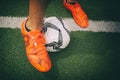 Soccer ball and feet on grass Royalty Free Stock Photo