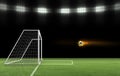 Soccer ball on fire is flying into the goal on the soccer field. ball game concept Royalty Free Stock Photo