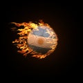 A soccer ball with the flag of Argentina burning with fire flies Royalty Free Stock Photo