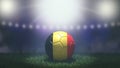 Soccer ball in flag colors on a bright blurred stadium background. Belgium. Royalty Free Stock Photo