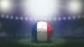 Soccer ball in flag colors on a bright blurred stadium background. France Royalty Free Stock Photo