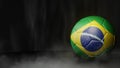 Soccer ball in flag colors on a dark abstract background. Brazil. Royalty Free Stock Photo