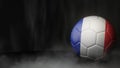 Soccer ball in flag colors on a dark abstract background. France. Royalty Free Stock Photo