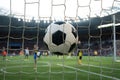 Soccer ball flies into goal on field, capturing moment of victory and achievement Royalty Free Stock Photo