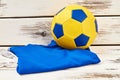 Soccer ball and folded uniform