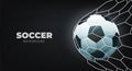 Soccer ball in goal net with black background. Royalty Free Stock Photo