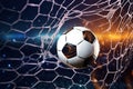 Soccer ball in goal net. Soccer ball tearing and breaking football net. Royalty Free Stock Photo