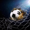 Soccer ball in goal net. Soccer ball tearing and breaking football net. Royalty Free Stock Photo