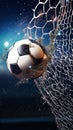 Soccer ball in goal net. Soccer ball tearing and breaking football net. Royalty Free Stock Photo