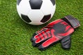 Soccer ball and goalkeeper gloves Royalty Free Stock Photo