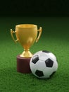 Soccer ball and golden cup of the winner on a green grass lawn. Youth tournament winner concept. 3d illustration