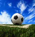 Soccer ball on grass background