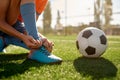 Soccer ball on grass and children football team training Royalty Free Stock Photo