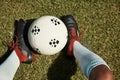 Soccer ball, grass field and shoes, soccer player and sport, athlete feet and fitness, sports game and training closeup Royalty Free Stock Photo