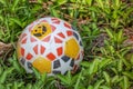 Soccer ball on grass material plastic