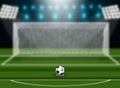 Soccer ball on green field in front of goal post. Royalty Free Stock Photo