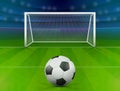 Soccer ball on green field in front of goal post Royalty Free Stock Photo