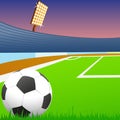 Soccer ball on green field of the stadium Royalty Free Stock Photo