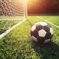 Soccer ball on green grass near soccer goal, game, sport theme. Generative AI