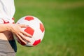 Soccer ball in hand. football game concept. copy space. close-up