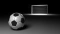 Soccer ball lies against the gate. Isolated on black background. 3D-rendering. Royalty Free Stock Photo